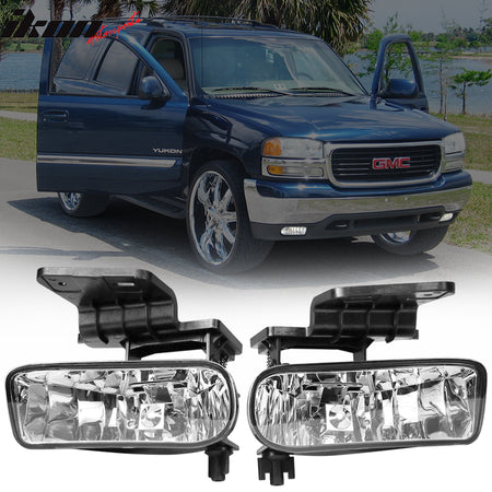 Blue GMC Yukon SUV on a road with two headlight assemblies displayed below.